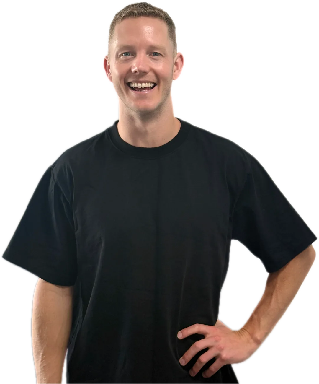 Nic Thomson, founder of Iceberg, smiling with one hand on his hip